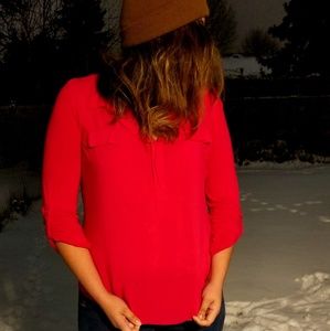 Pink long sleeve blouse with front pockets